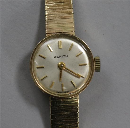 A ladys 9ct. gold Zenith manual wind wrist watch on 9ct gold bracelet.